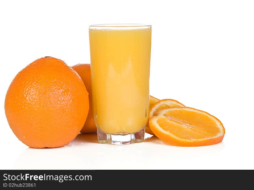 Sliced yellow orange and juice on white