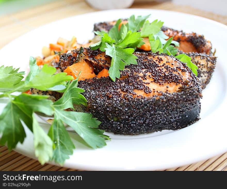 Dinner of grilled salmon, breaded poppy. Dinner of grilled salmon, breaded poppy