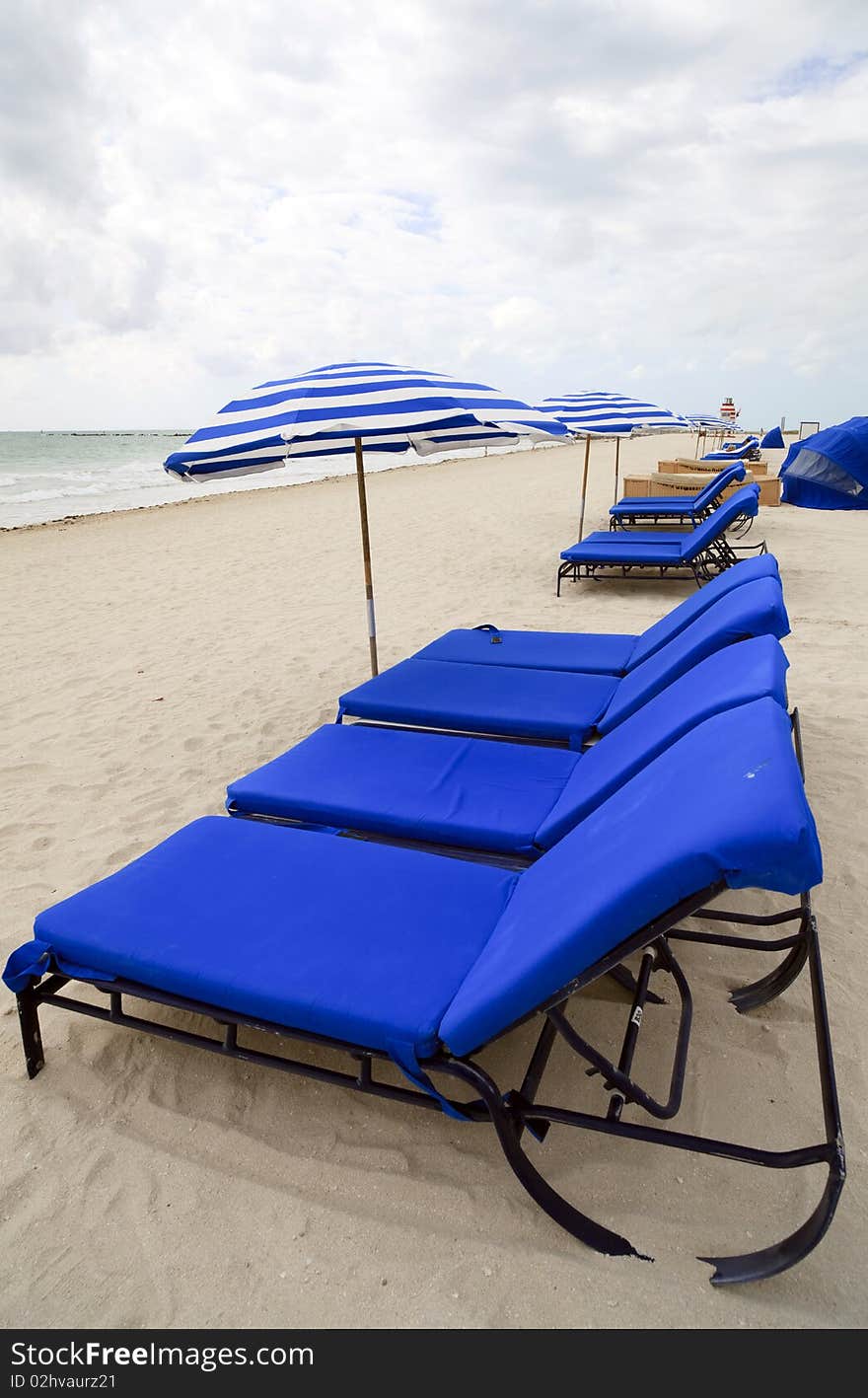 Beach Lounge Chairs And Umbrellas