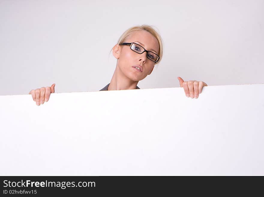 Businesswoman holding blank sign isolated on white. Businesswoman holding blank sign isolated on white