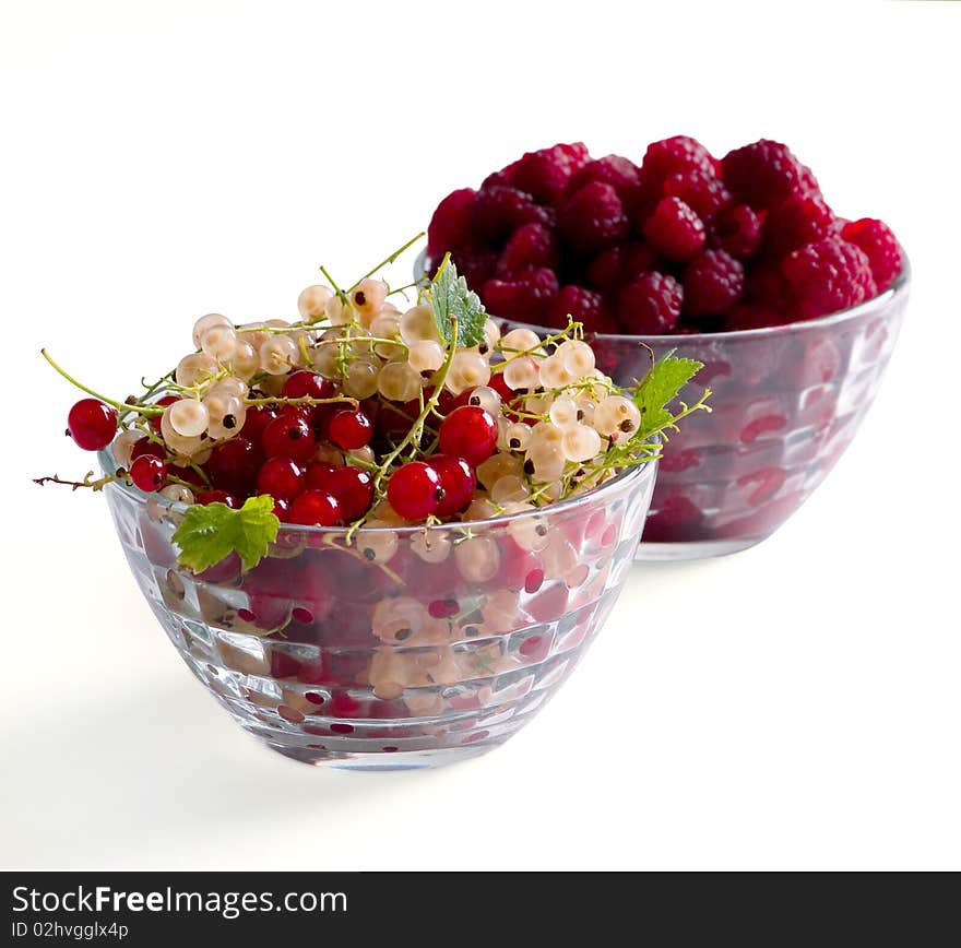 Fresh Raspberry and currant isolated on white background