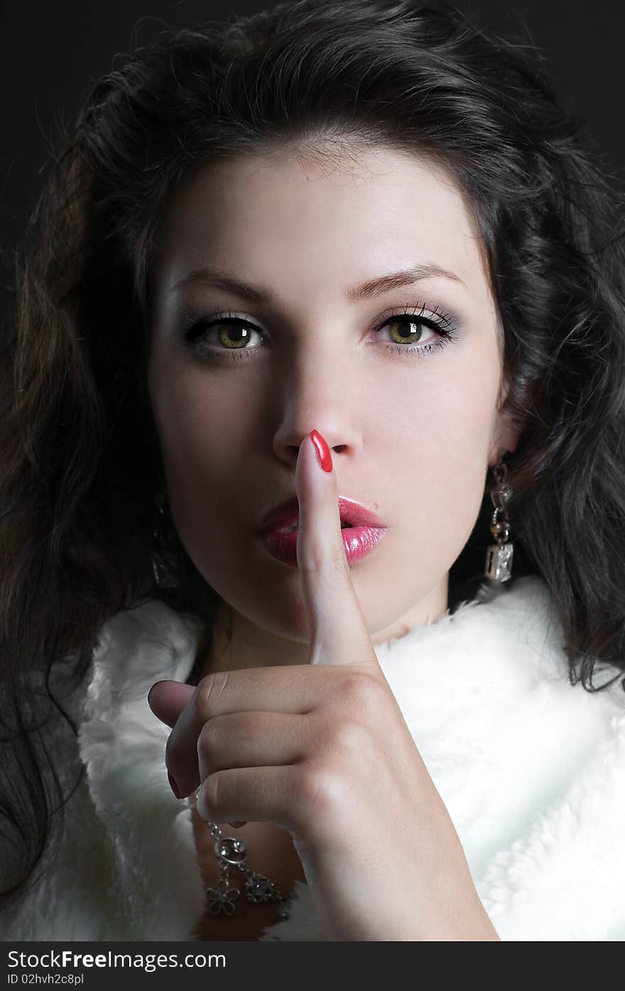 Young Woman Gesturing for Quiet or Shushing