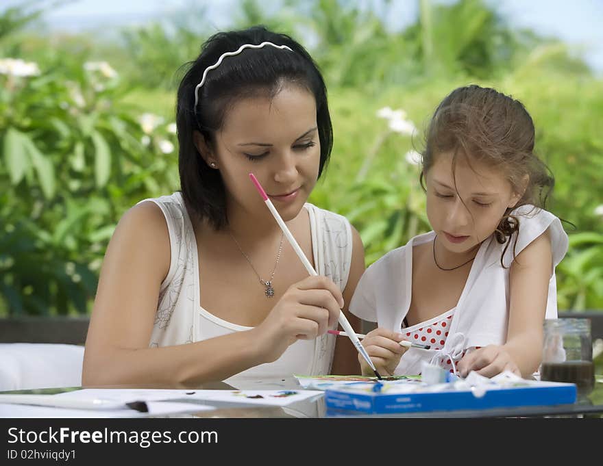 Portrait of happy mother with daughter  having good time in summer environment. Portrait of happy mother with daughter  having good time in summer environment