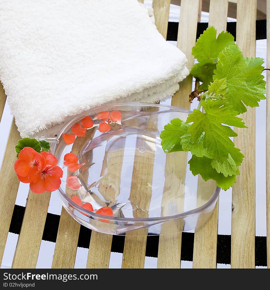 Bowl For A Manicure And A Towel On A Lounger