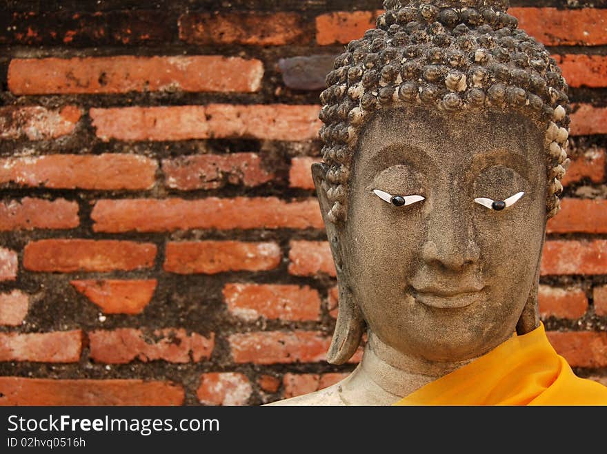 Buddha image head in the old temple in Ayudhaya, Thailand