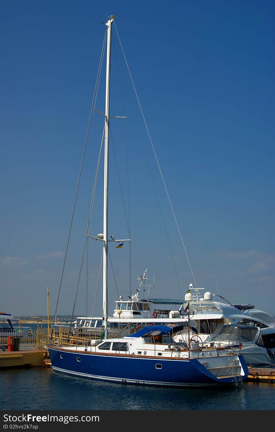 Blue modern yacht in port. Blue modern yacht in port