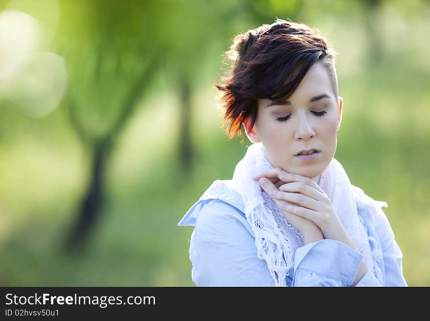 Young girl in emotional gesture with eyes closed. Young girl in emotional gesture with eyes closed.