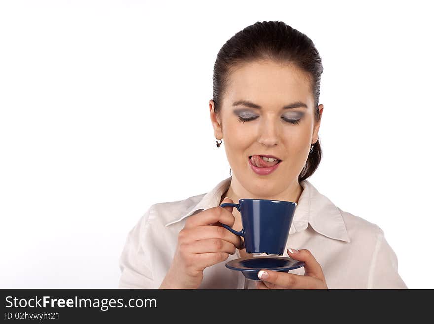 A young woman enjoying a cup of coffee. A young woman enjoying a cup of coffee