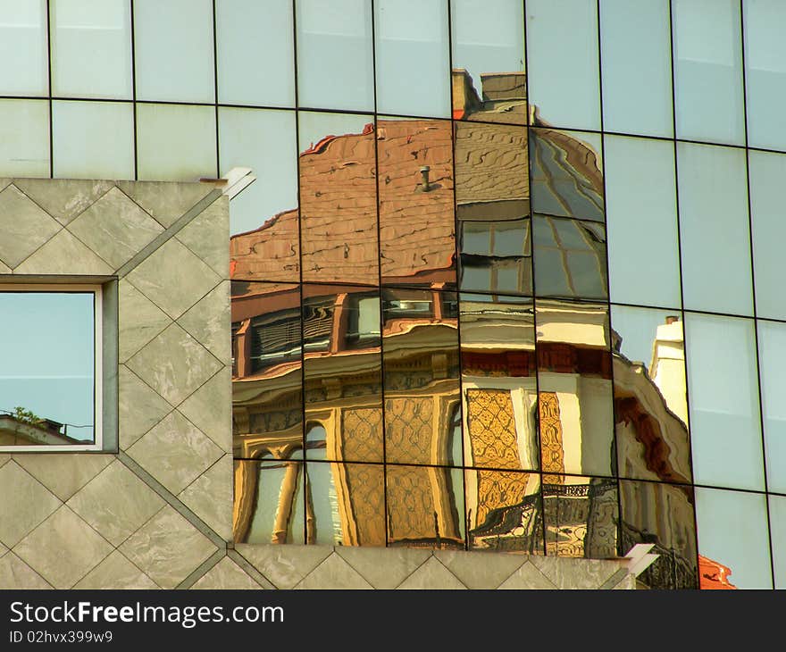 Building mirrored in a building. Building mirrored in a building