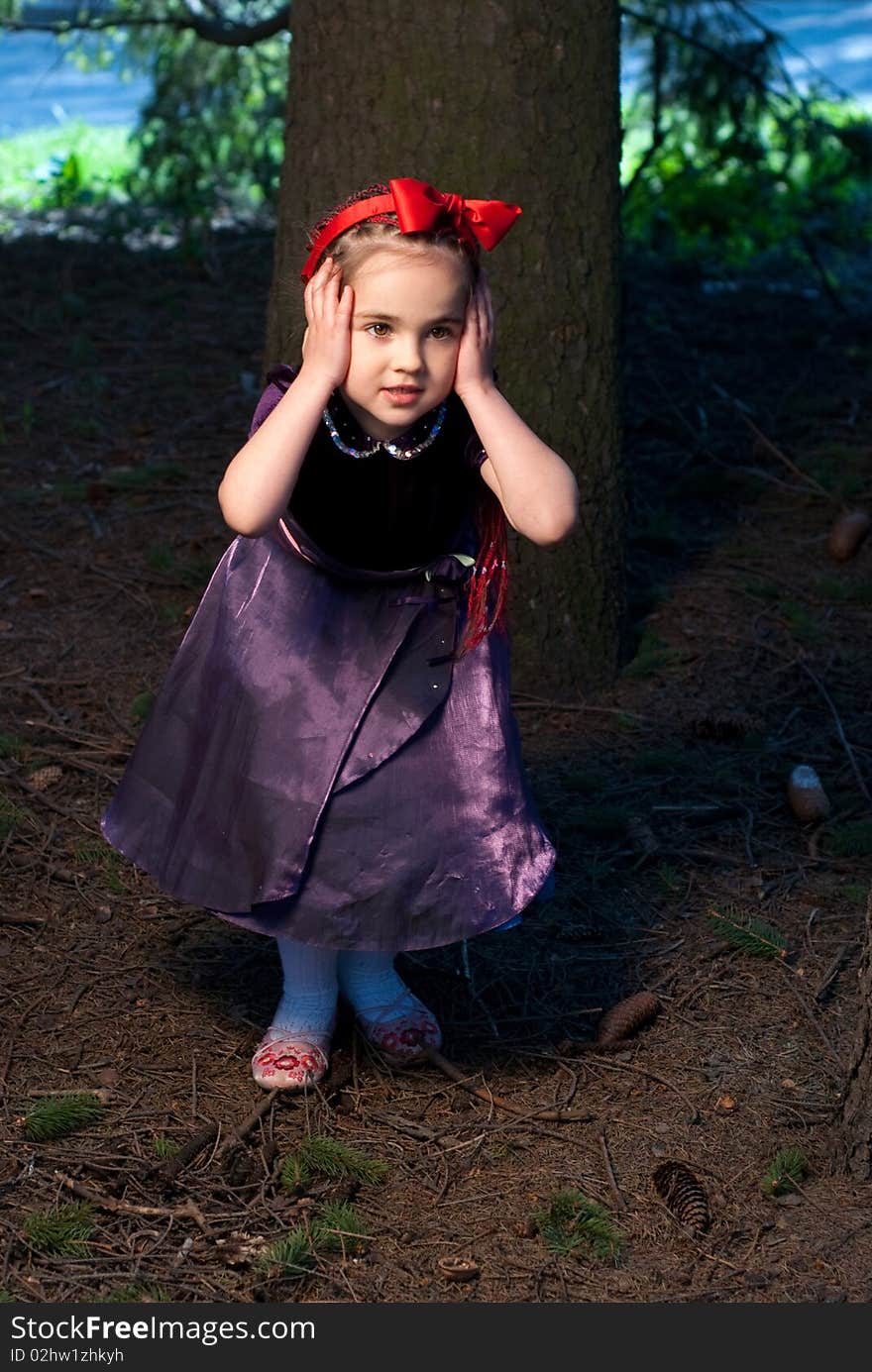 Snow white little girl in forest