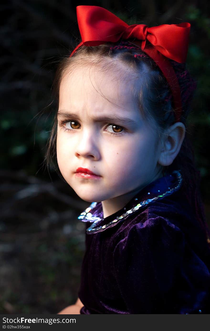 Snow white little girl in forest