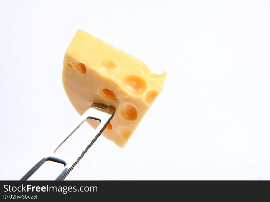 Some cheese on a cheese knife