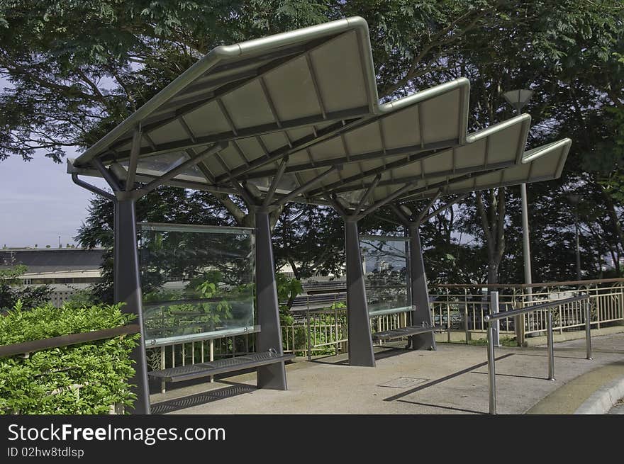 Structural steel modern designed bus stop with cantilevered metal roof. Structural steel modern designed bus stop with cantilevered metal roof