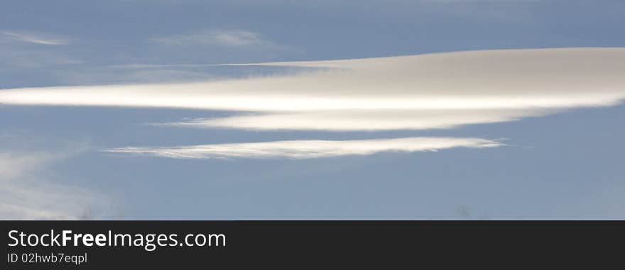 Lenticular cloud formation in blue sky