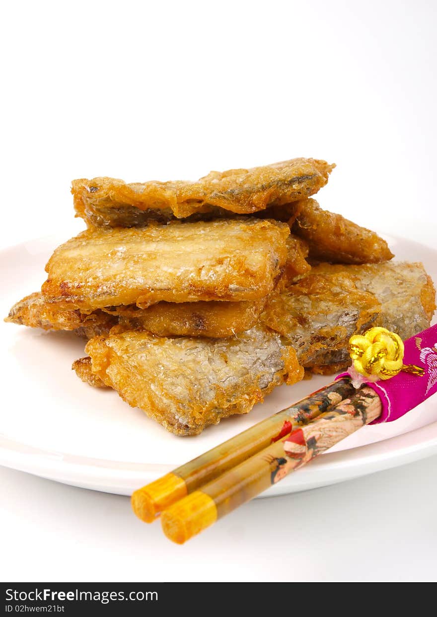 Fresh fried Conger fish. On a plate. Close up on white background