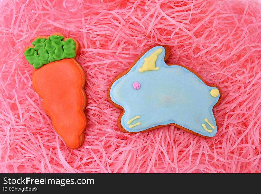 Close up of easter cookies on pink ribbons as background.