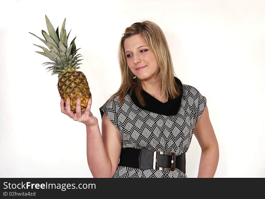 Portrait of the woman holding pineapple in the hand. Portrait of the woman holding pineapple in the hand