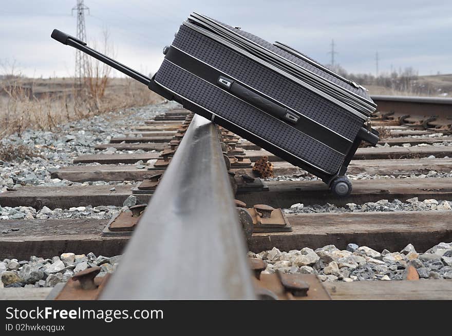 She was lying on railroad tracks, has a handle, the foreground is blurred, wooden sleepers. She was lying on railroad tracks, has a handle, the foreground is blurred, wooden sleepers