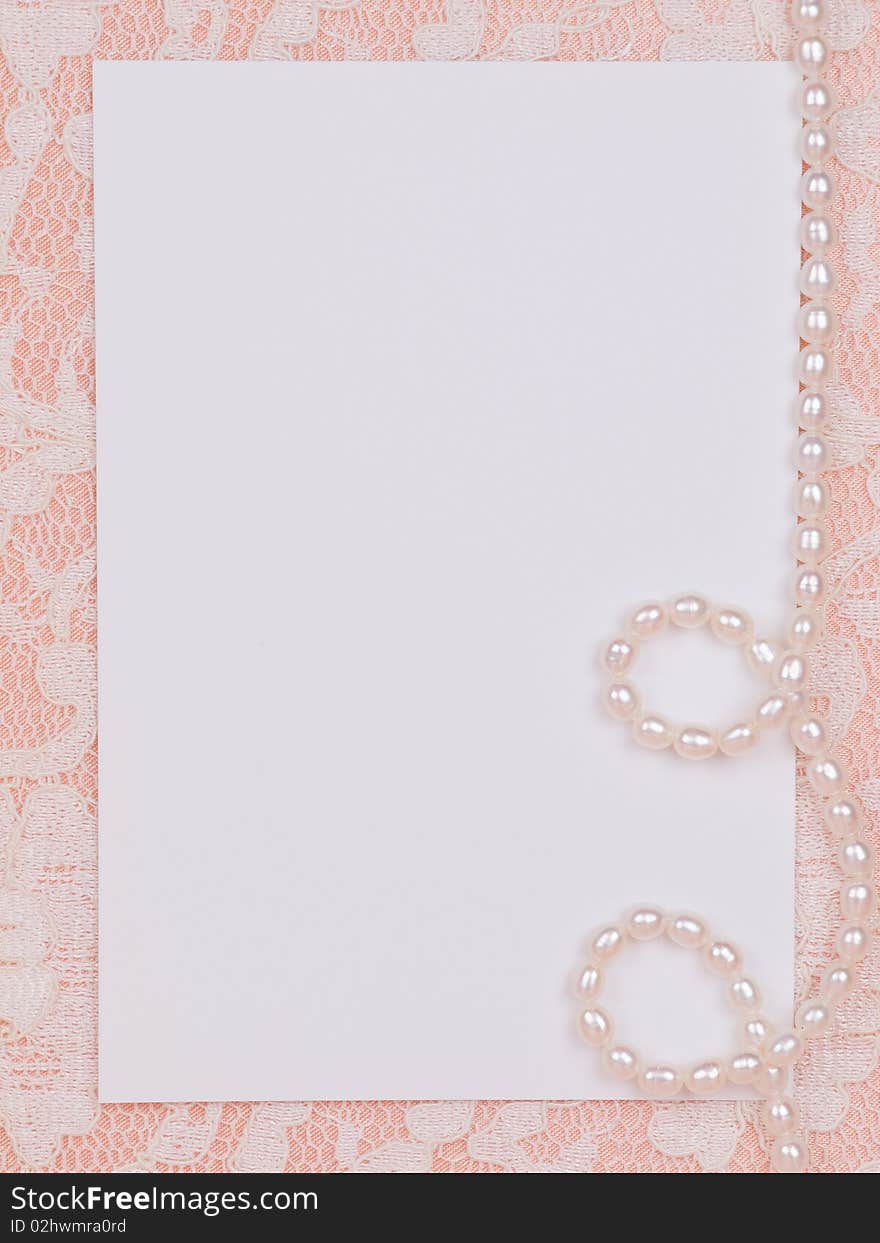 White card for congratulation on a background from lace