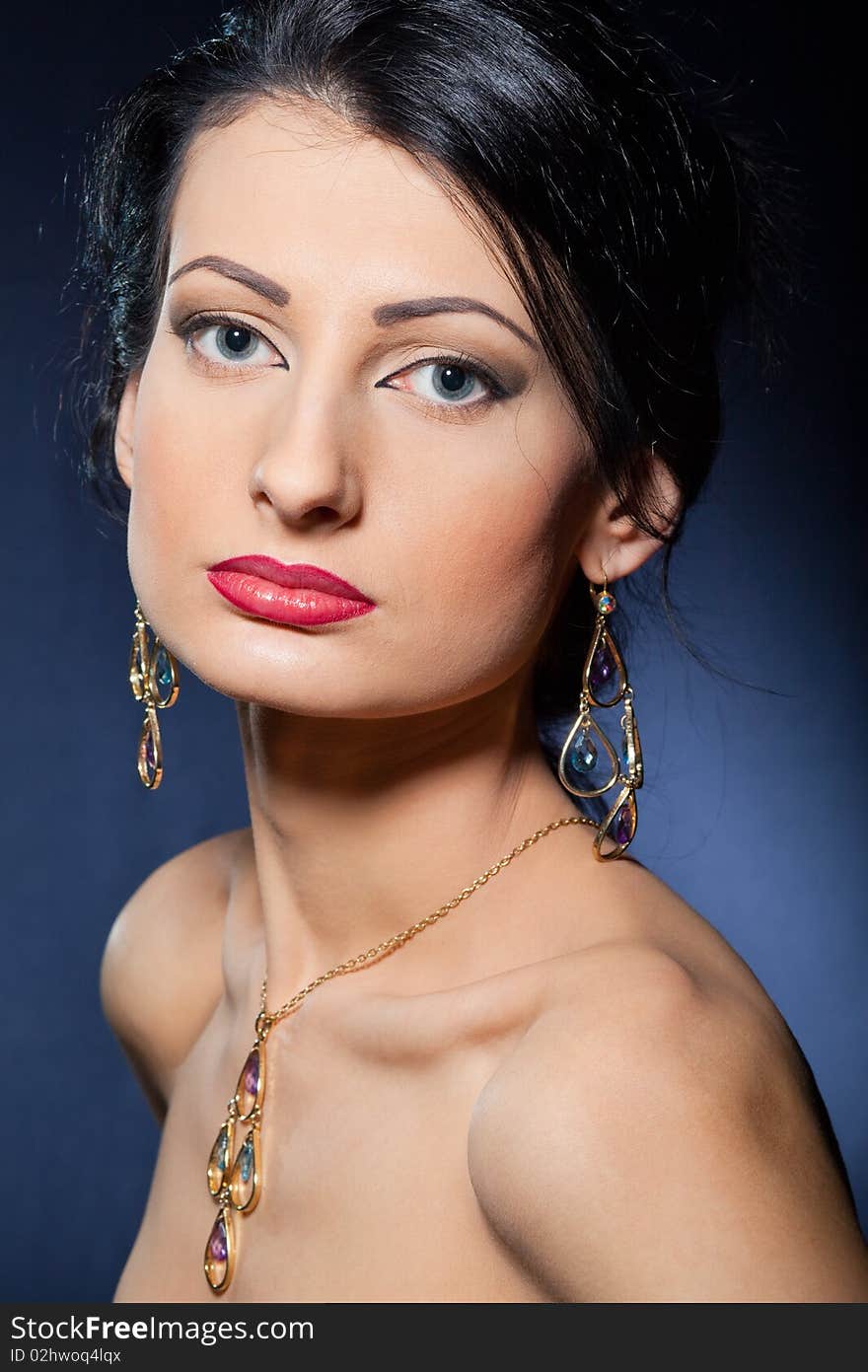 Portrait of elegant beautiful woman wearing jewelry.