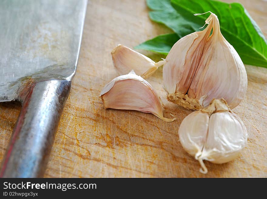 Fresh garlic with knife