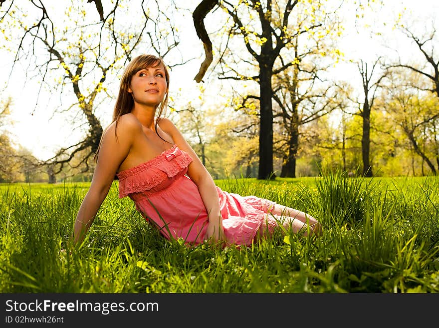 Relaxing dreaming parc female enjoying late summer day