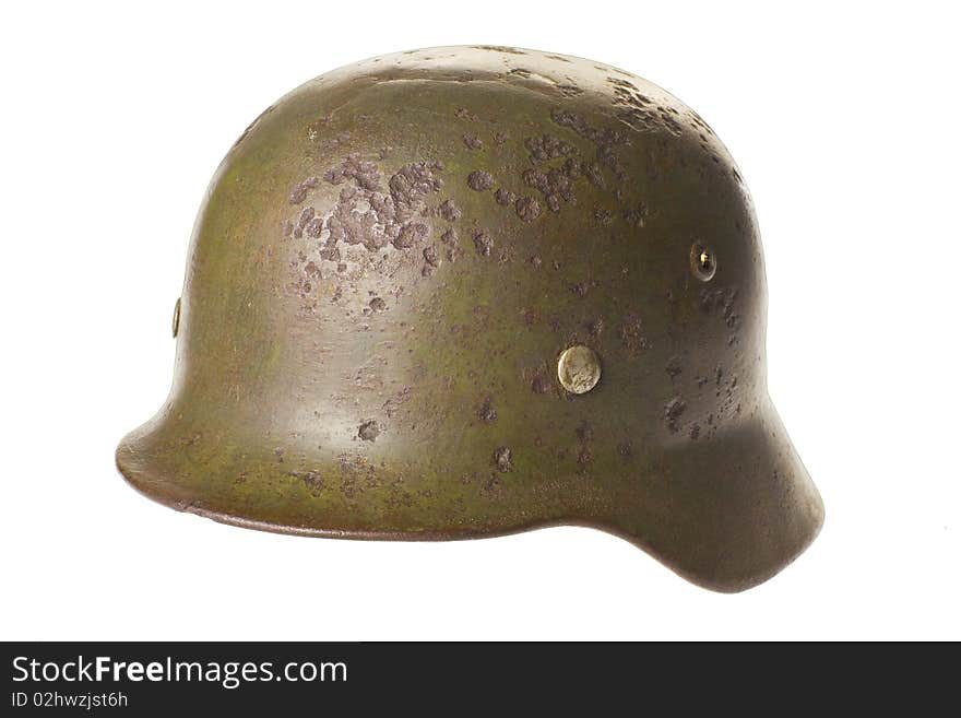 Old German fashists helmet of times of the second Great world war on a white background with clipping path. Old German fashists helmet of times of the second Great world war on a white background with clipping path.