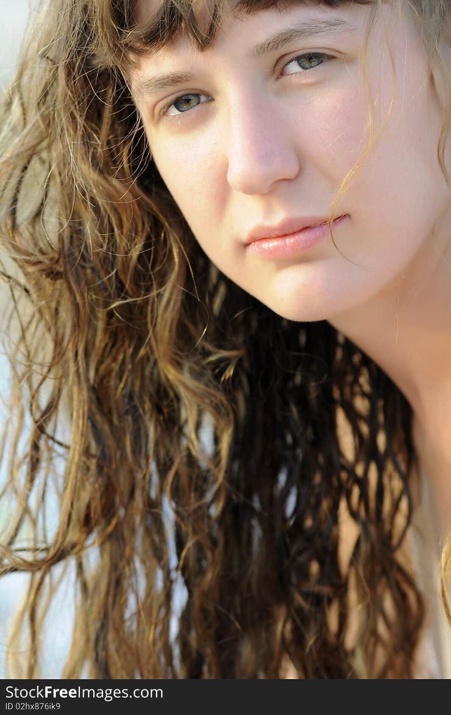 A beautiful girl photographed after pool swimming in summer