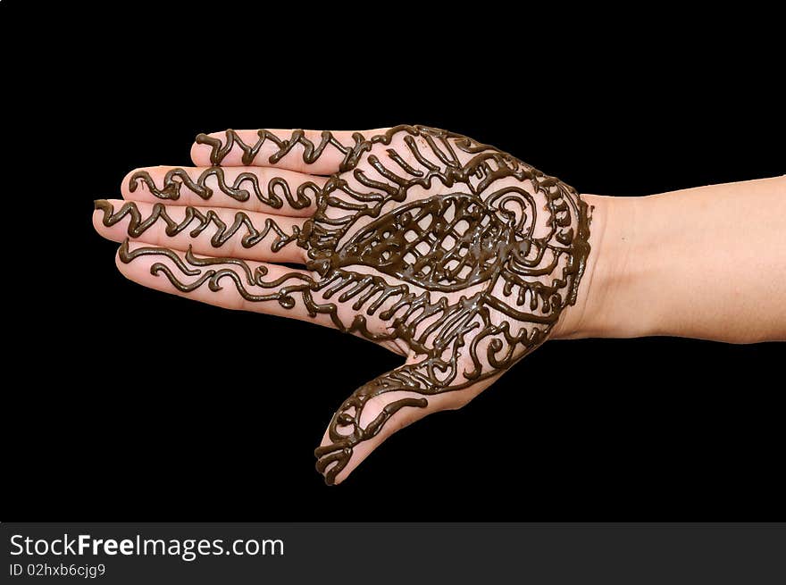 A design on hands against a black  background