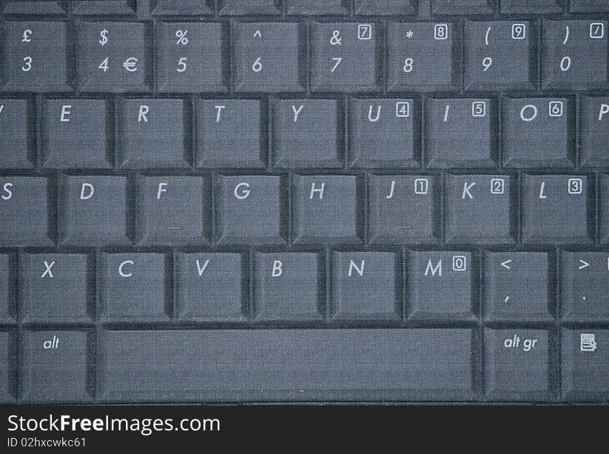 Laptop keyboard with textured surface