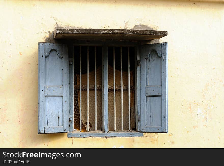 An old window on an overcast tropical summer