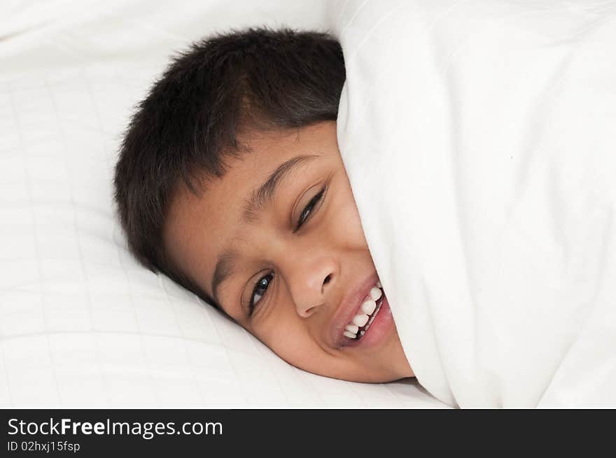 A handsome indian kid smiling for you