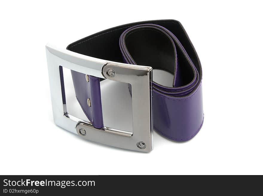 Metal buckle and purple belt isolated on white. Metal buckle and purple belt isolated on white