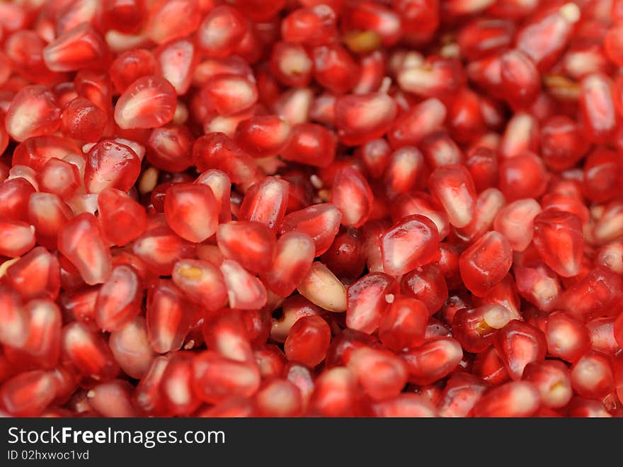 Close up shot of fresh and juicy seeds in a pomegranate