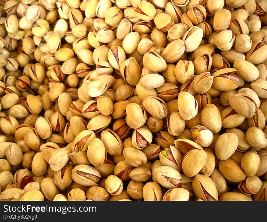 A pile of pistachios on a  fruit market