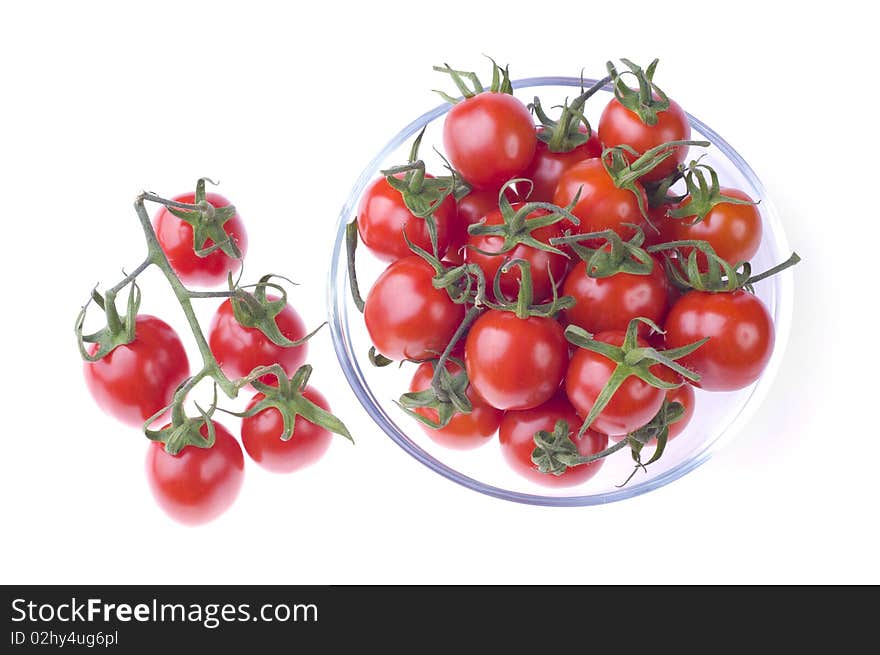 Pot of cherry tomatoes on white background