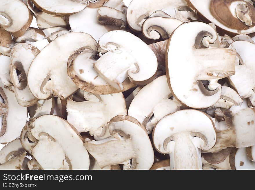 Sliced brown mushrooms on a white background. Sliced brown mushrooms on a white background