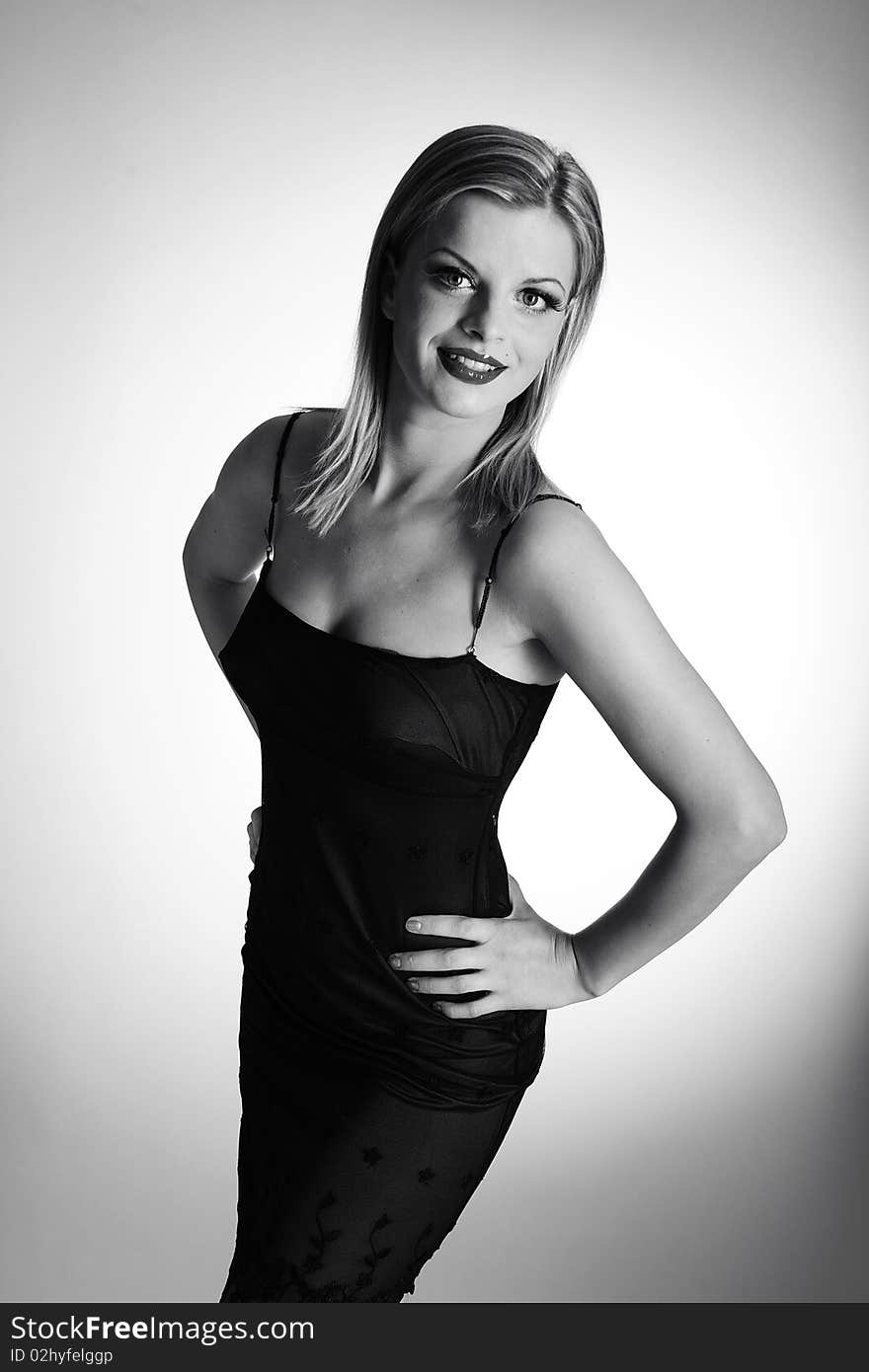 B/w Portrait of fashion woman with red lips in black dress with bird feather. white background. B/w Portrait of fashion woman with red lips in black dress with bird feather. white background