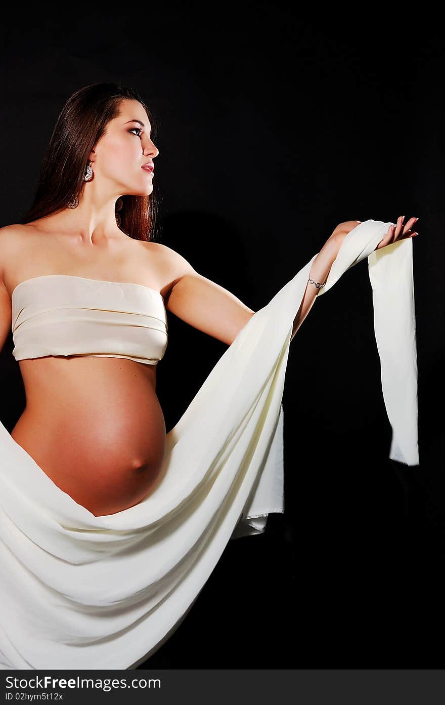 Pretty Pregnant Girl In A White Fabric