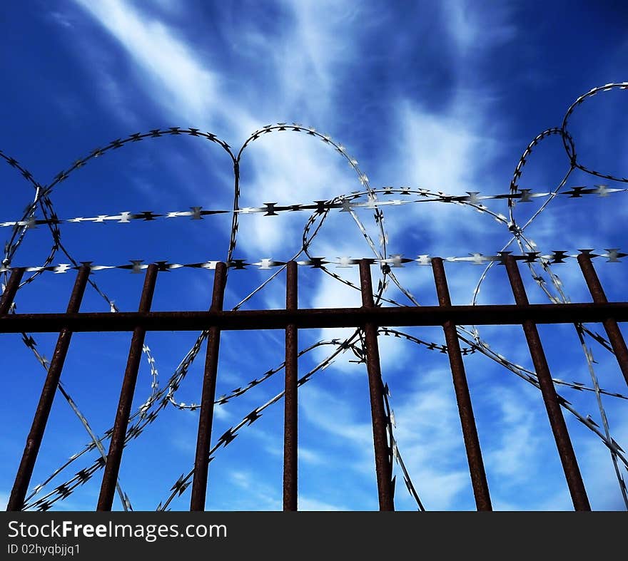 A gate with Razorwire for security concepts.