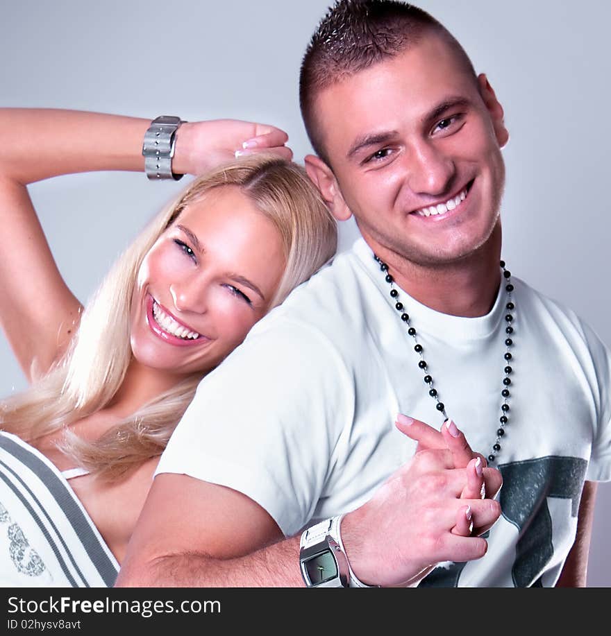 Young love couple smiling, studio shot