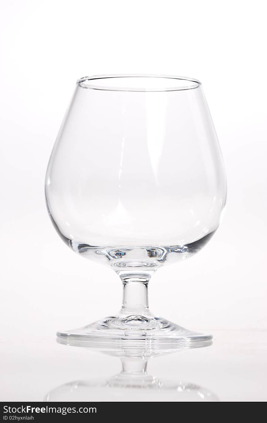 Drink series: empty brandy glass over white. Drink series: empty brandy glass over white