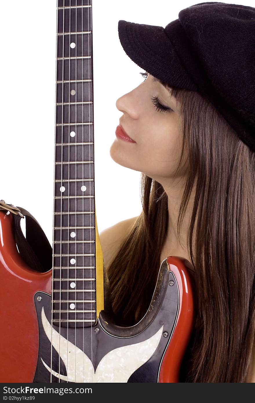 Young woman with beret hat holding red electric guitar. Young woman with beret hat holding red electric guitar