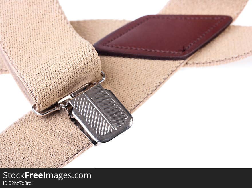 Man's wide beige braces on a white background.