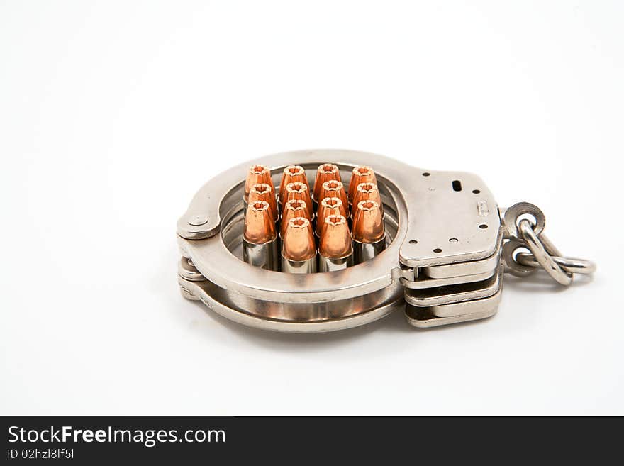 14 9 mm bullets inside a pair of handcuffs. 14 9 mm bullets inside a pair of handcuffs