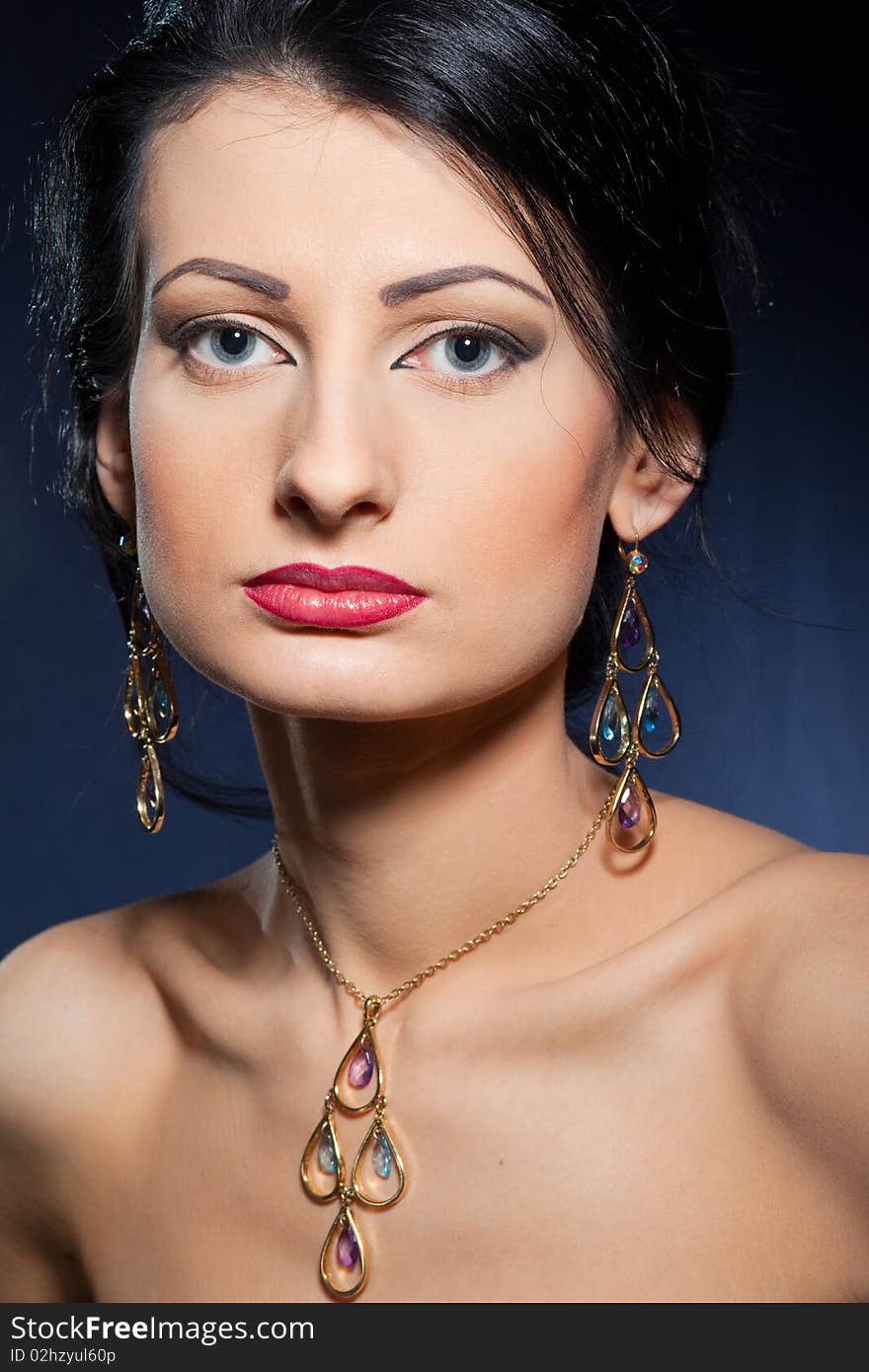 Portrait of elegant beautiful woman wearing jewelry.