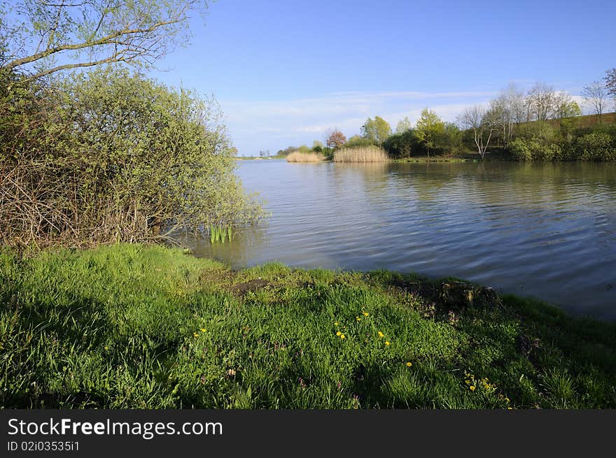 View on the picturesque artificial lake. View on the picturesque artificial lake