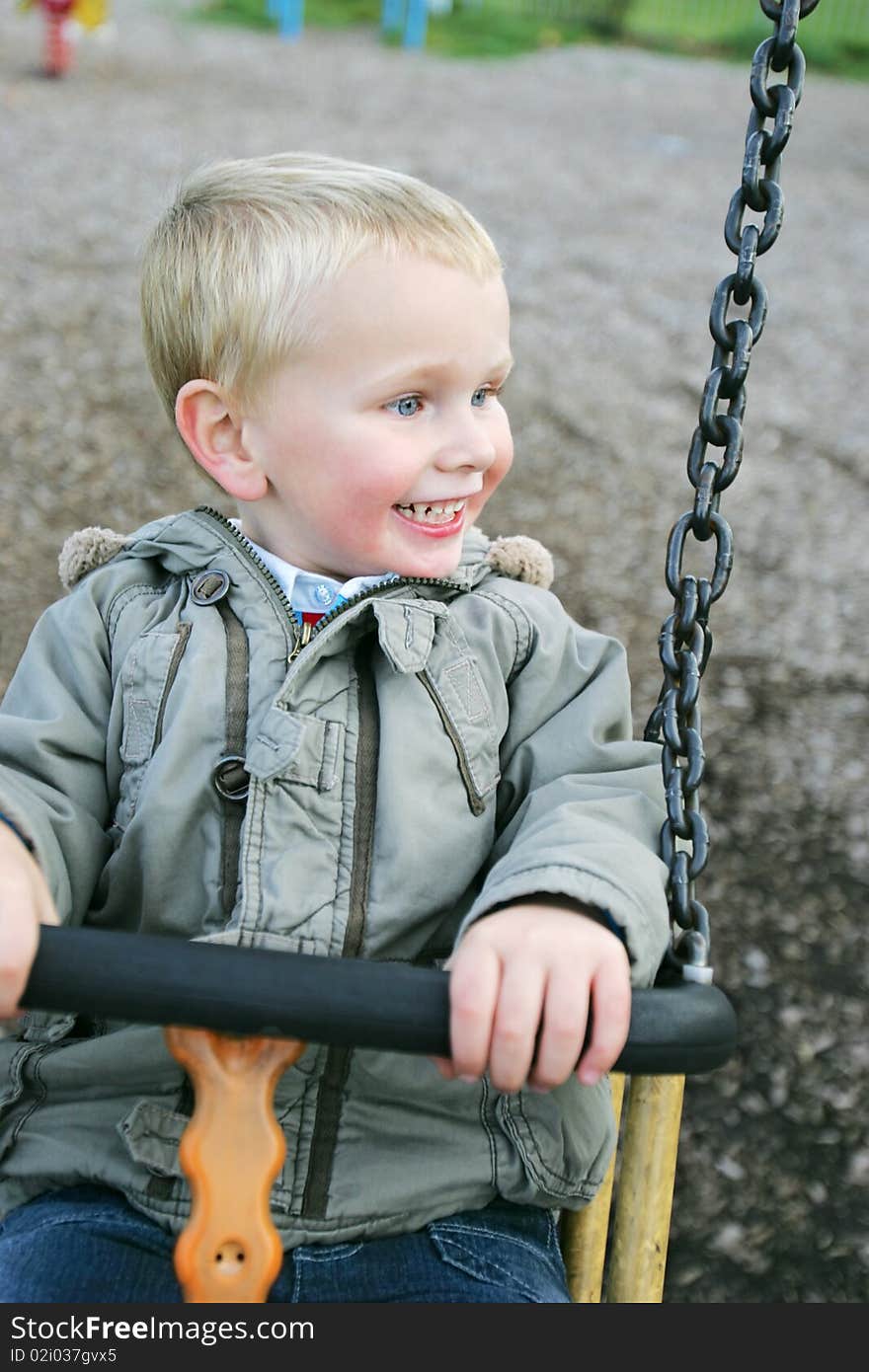 Healthy three year old boy playing in park. Healthy three year old boy playing in park