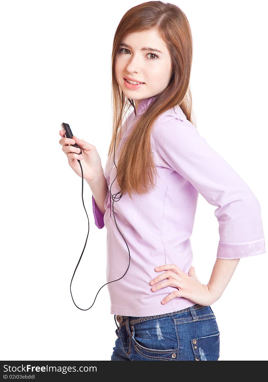 Young girl listening to music om mp3 player. Isolated on white background