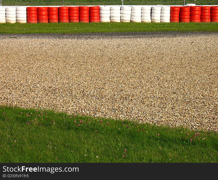 Run-off area with gravel trap and old tyres. Run-off area with gravel trap and old tyres